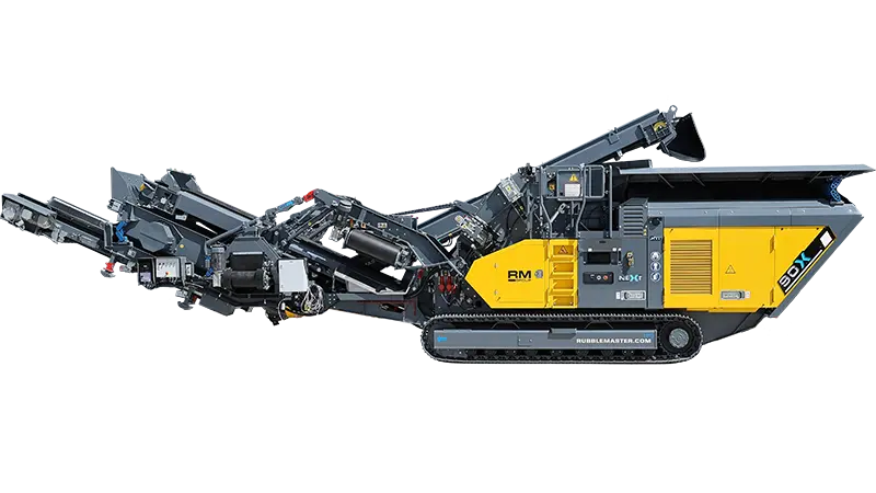 RM 90X in operating position on a quarry pad with the discharge conveyor folded out.