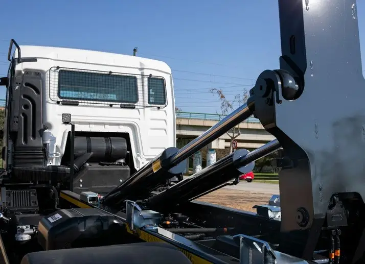 Cayvol Multivol hooklift container carrier mounted on a truck.