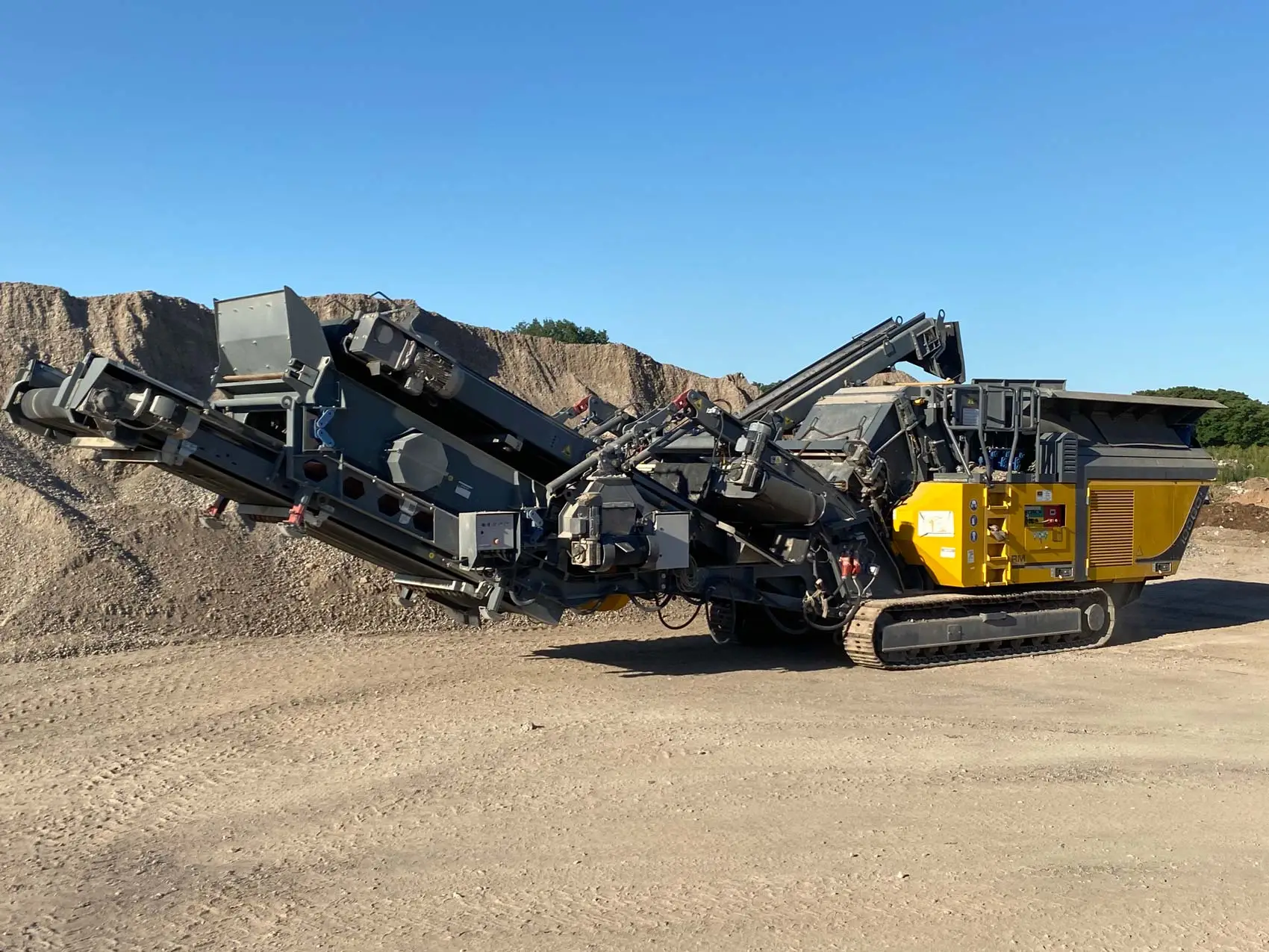 Mobile crusher processing rock at an Australian quarry.